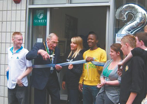 Chairman of Surrey County Council, Geoff Marlow, prepares to cut the ribbon at the opening of Street Youth Centre. Photograph by Ann Highgate.