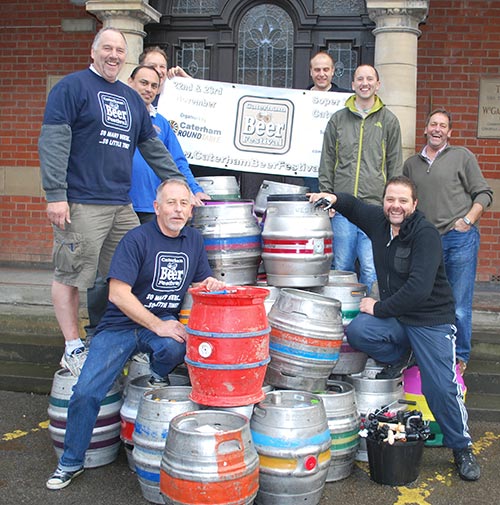 Members of Caterham Round Table with the empty beer barrels after the event. Photo by Andy Parr.